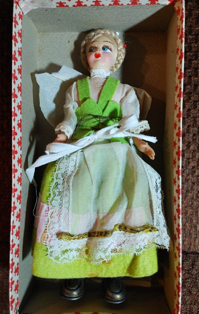 Souvenir foreign girl doll in box. Hard plastic, felt type face. Pre-owned.